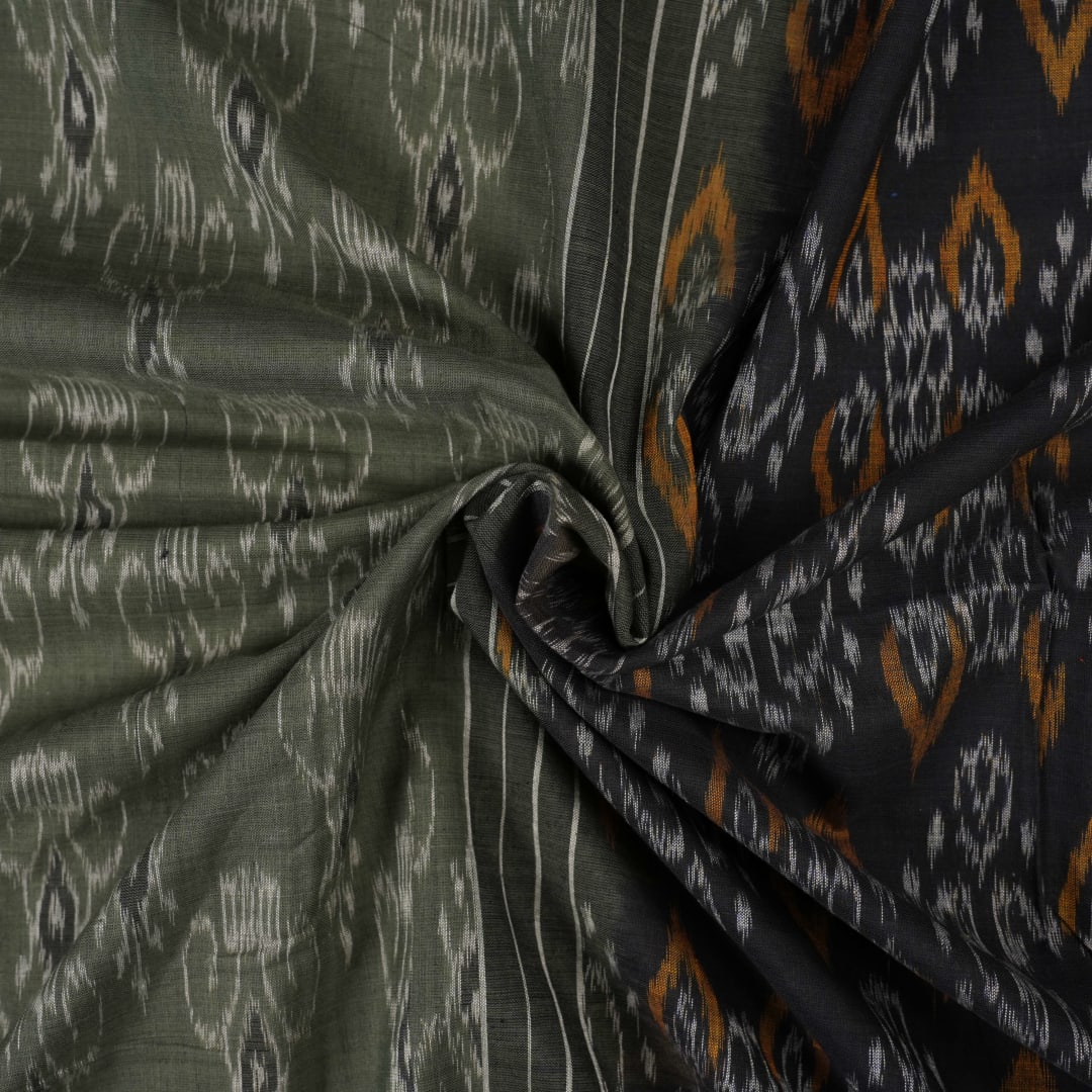 Elegant model drape of the grey and black Sambalpuri cotton saree showcasing traditional handloom motifs.