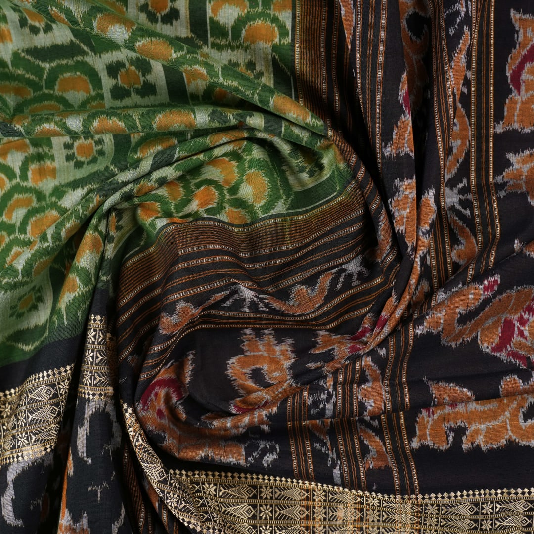 Full layout of green and black Sambalpuri cotton saree showcasing the complete pattern and motifs.