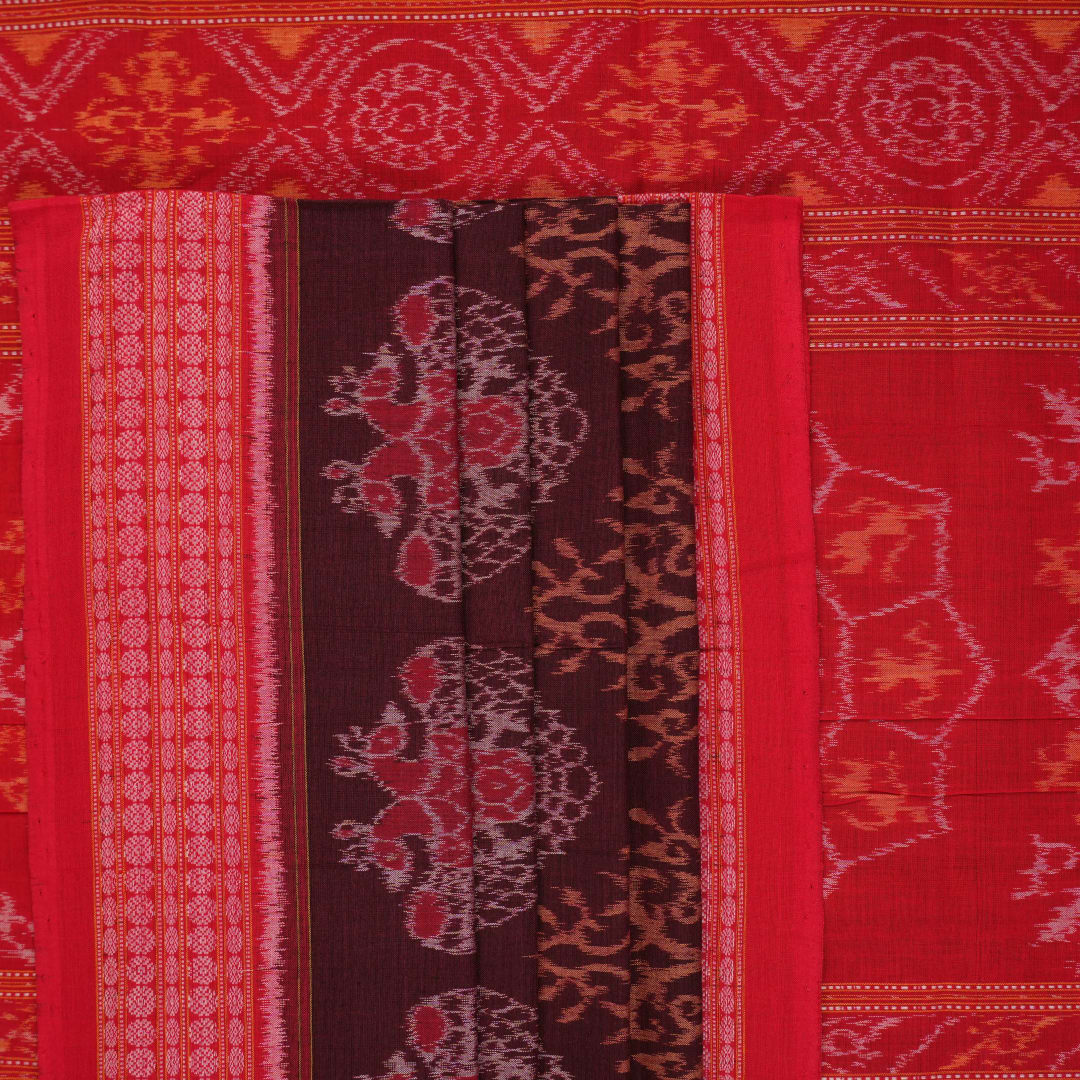 Full layout of a maroon and red Sambalpuri cotton saree displaying the complete body motifs and border.
