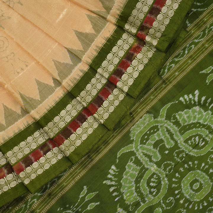 Extreme close-up of cream Sambalpuri silk saree showing exquisite handloom weave texture.
