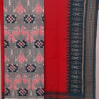 Detail of grey Sambalpuri Cotton dress material blouse piece with red motifs.