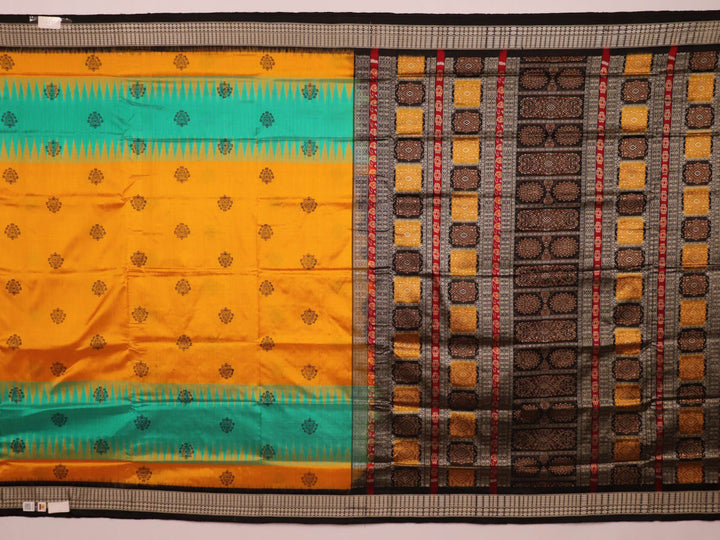 Close-up of yellow silk Bomkai saree fabric with black butta pattern