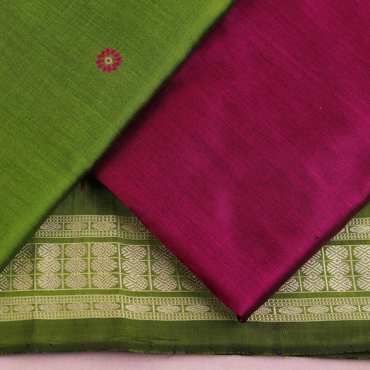 Green Bomkai silk dress material: Detail of magenta blouse piece with butta pattern.
