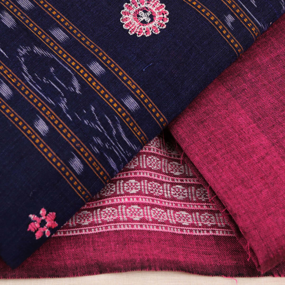 Close-up of blouse piece with blue and magenta motifs in Sambalpuri style