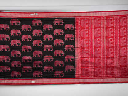 Close-up showing the luxurious texture and fine weave of the black Sambalpuri silk fabric.