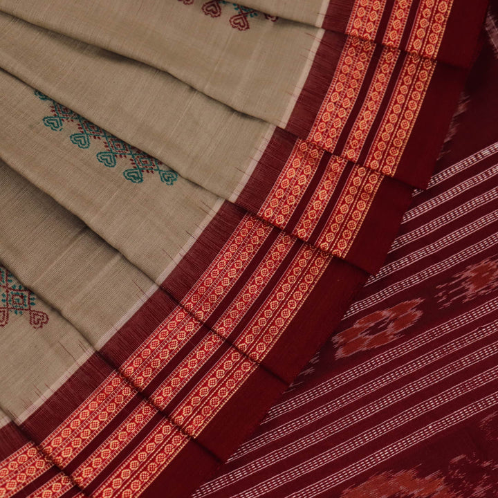 Full view of a traditional green and maroon cotton Bomkai saree featuring a butta pattern.