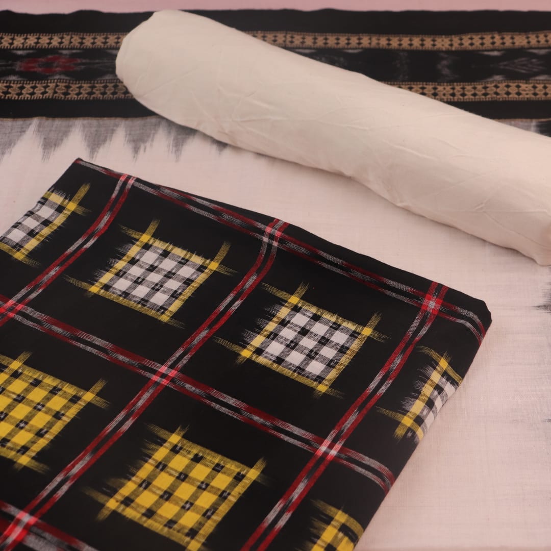 Detail of the black and white Sambalpuri cotton dress material's blouse piece with motifs.
