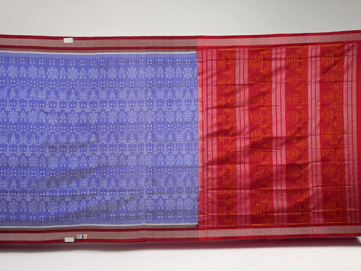 Close-up of the luxurious silk texture of the violet and maroon Sambalpuri Saree fabric.