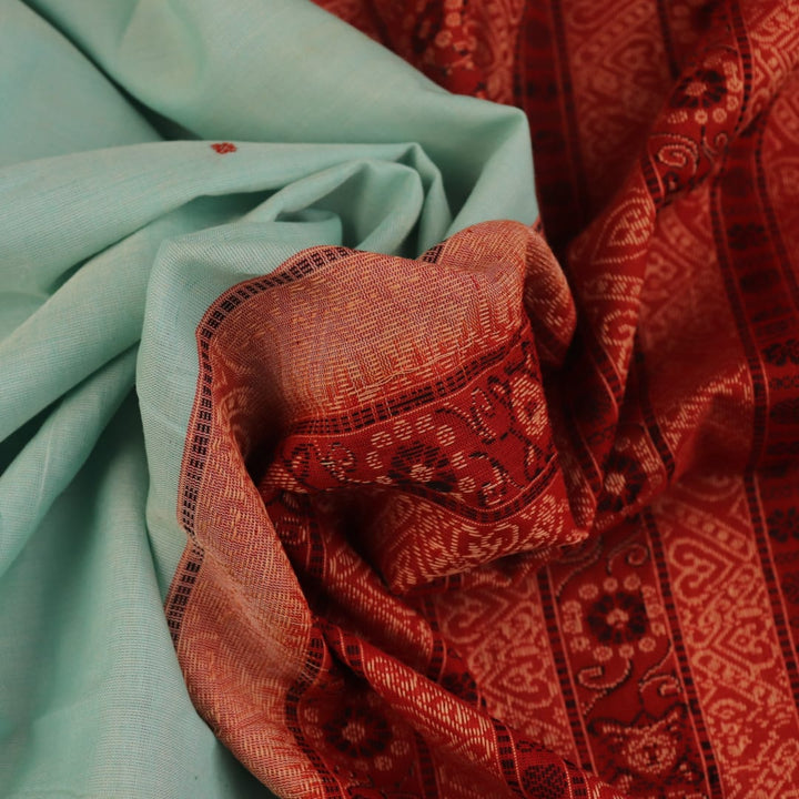 Full view of a handloom green and rust Bomkai cotton saree with butta pattern.