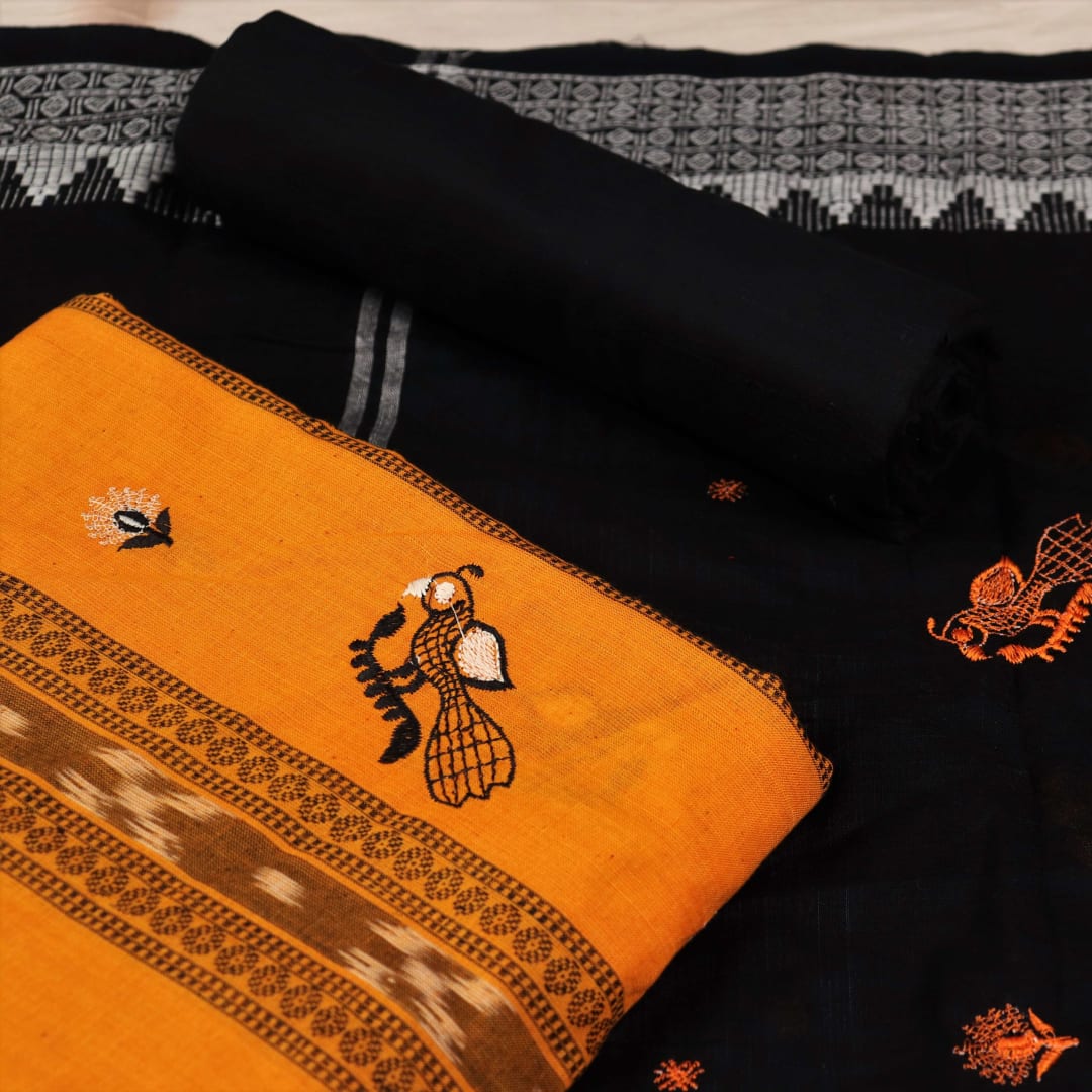 Close-up details of blouse piece with yellow and black motifs and embroidery on cotton Sambalpuri material