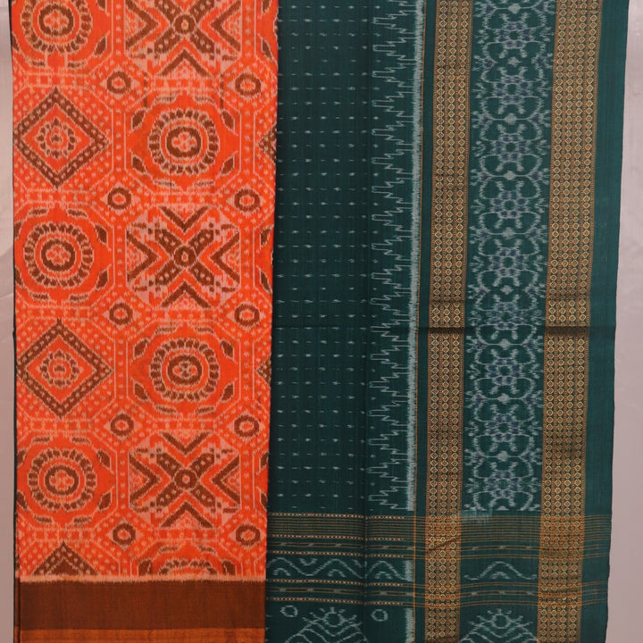 Blouse piece detail of an orange and green motif Sambalpuri cotton dress material.