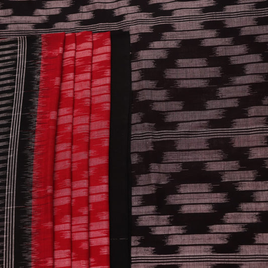 Red and black Sambalpuri cotton saree with motifs, elegantly draped.