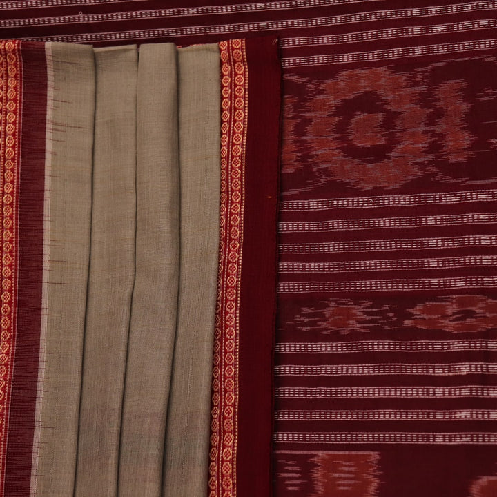 Full view of a traditional green and maroon cotton Bomkai saree featuring a butta pattern.