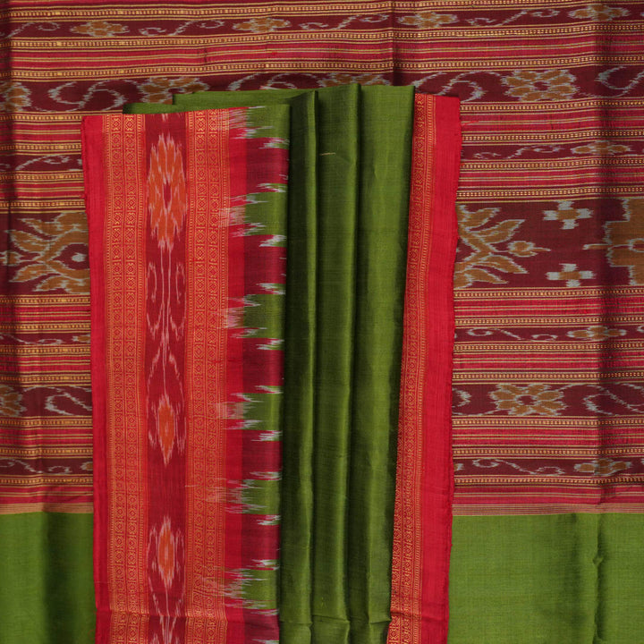 Model draped in a green and red Khandua silk saree with traditional butta work and rich border.