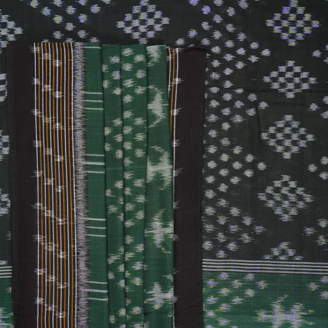 Elegant model draping a green and black Sambalpuri cotton saree with traditional Odisha handloom motifs.