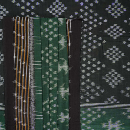 Elegant model draping a green and black Sambalpuri cotton saree with traditional Odisha handloom motifs.