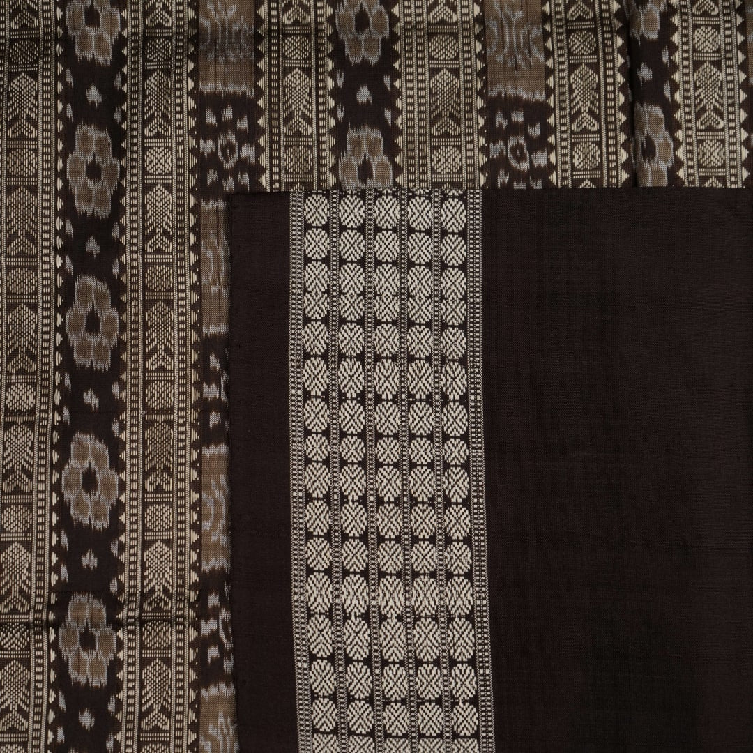 Close-up of the grey and black Sambalpuri Silk Saree fabric, highlighting its rich silk texture and weave.