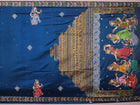 Close-up of handloom blue silk Patachitra saree fabric, showcasing the fine texture and hand-painted details.