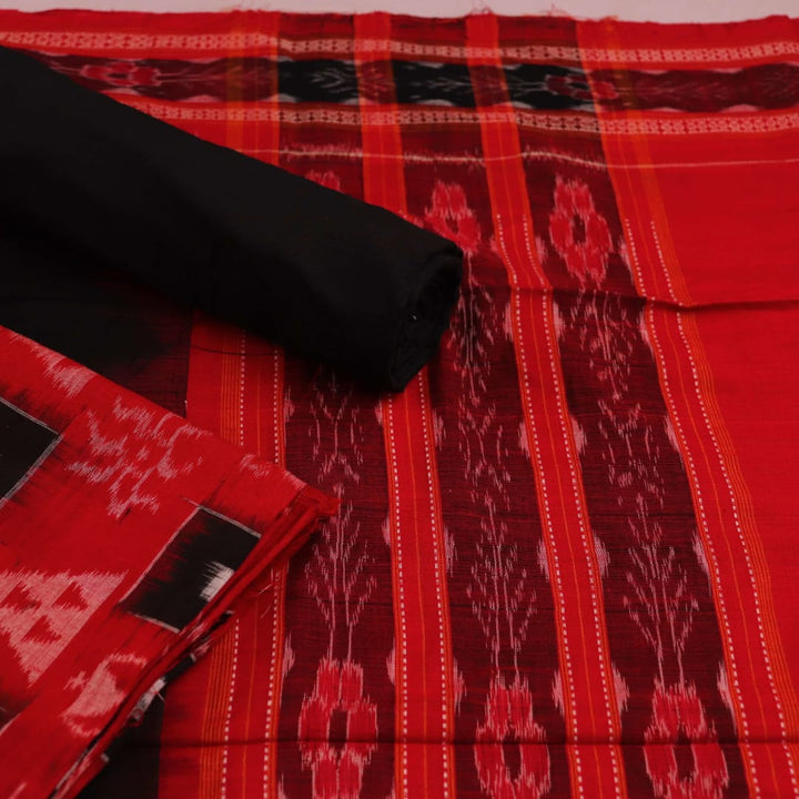 Close-up detail of motifs on a red and black cotton Sambalpuri dress material