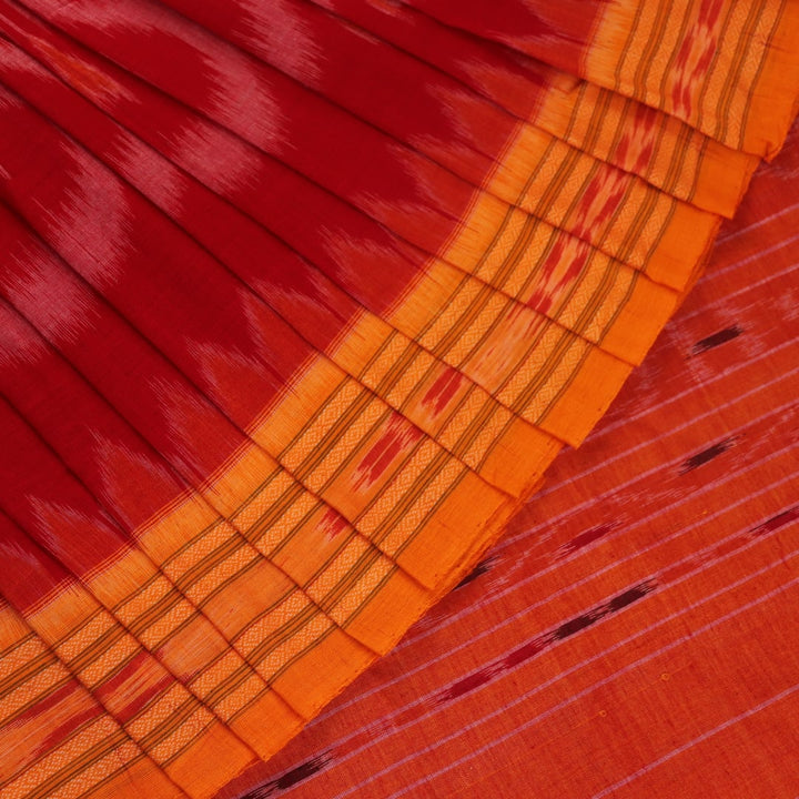 Red and yellow Sambalpuri cotton saree with motifs, elegantly draped to showcase its style.