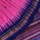 Close-up of pink and blue Dongria Silk Saree fabric texture with butta pattern.