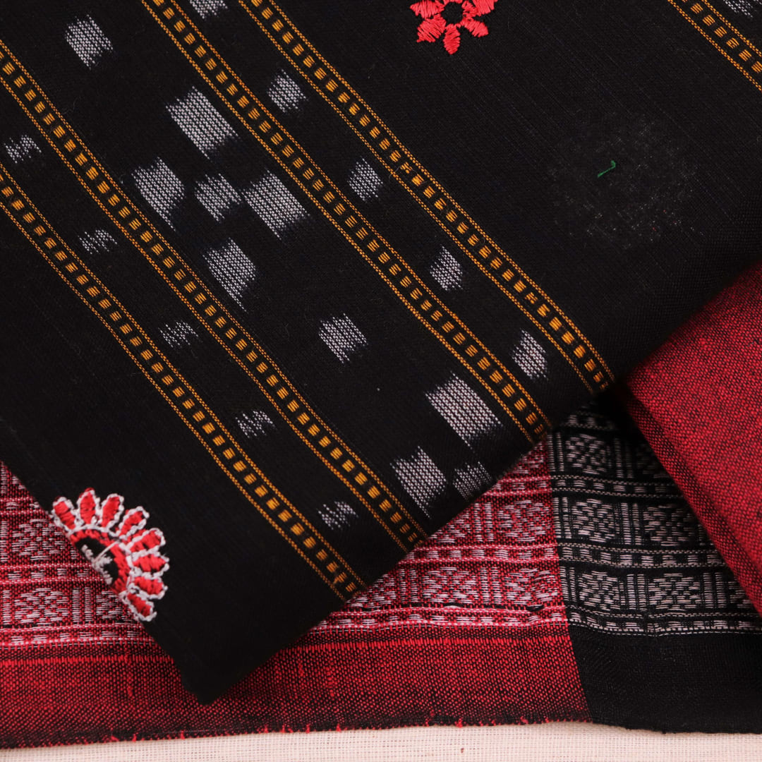 Fourth image in the series: Handloom cotton Sambalpuri dress material in black and maroon, featuring intricate motif patterns on the blouse piece.