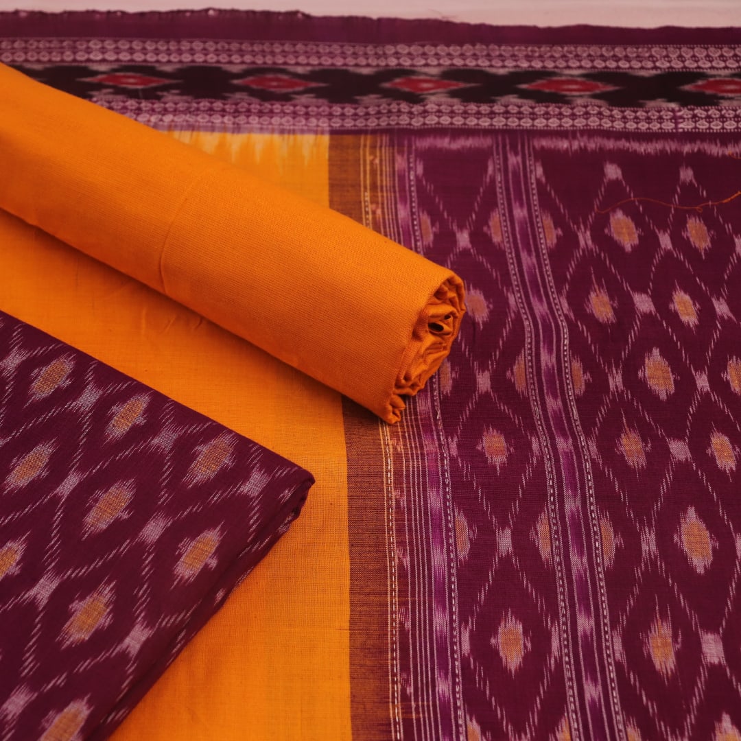 Close-up of purple and yellow motifs on Sambalpuri cotton dress material body.