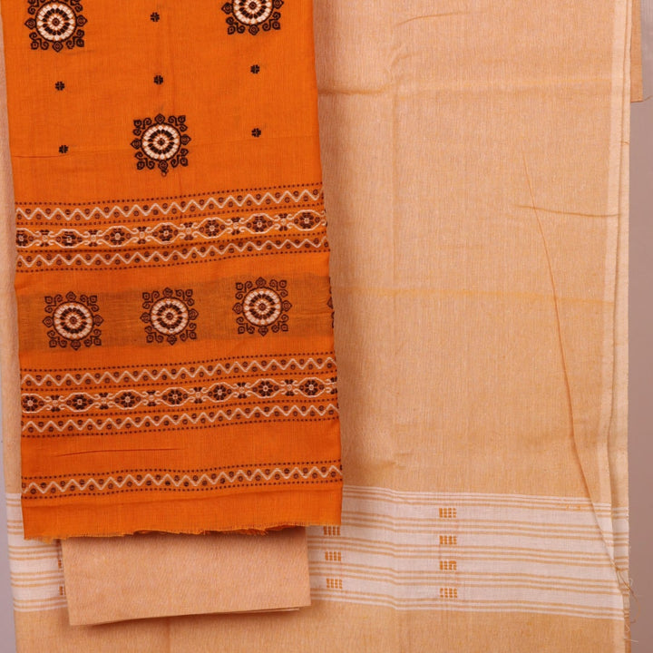 Detail of the coordinating blouse piece for the Bomkai cotton dress material in yellow and cream.