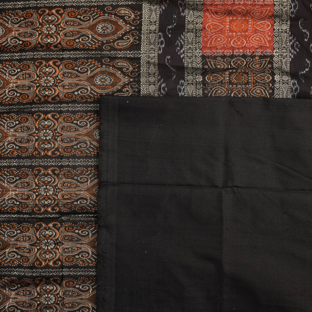 Ultra close-up of Bomkai Silk Saree fabric, revealing intricate handloom texture and butta weave details.