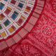 Close-up of the luxurious white Sambalpuri silk saree fabric, highlighting its rich texture and weave.
