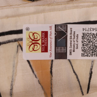 Close-up of white silk Patachitra saree, showcasing the handloom fabric's texture and subtle paint details.