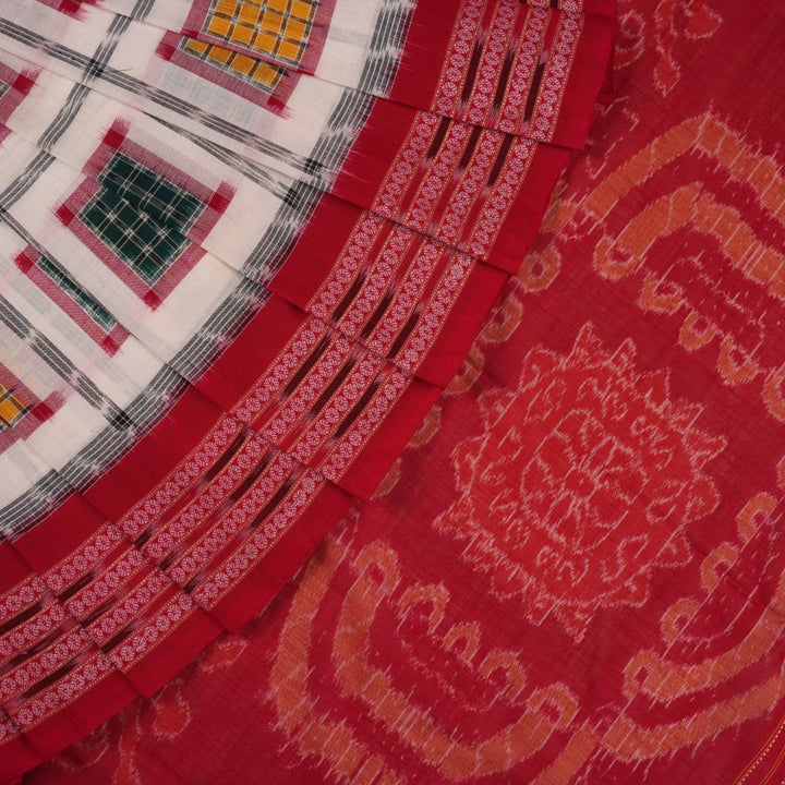 Model wearing a white and red Sambalpuri cotton saree with traditional motifs, styled for an elegant look.