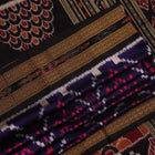 Stylish black and red silk Khandua saree with elaborate motifs draped in a traditional manner