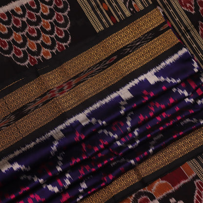 Stylish black and red silk Khandua saree with elaborate motifs draped in a traditional manner