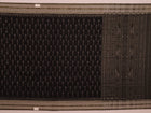 Saree styled; black Sambalpuri cotton saree with grey motifs showcased in a draped presentation.
