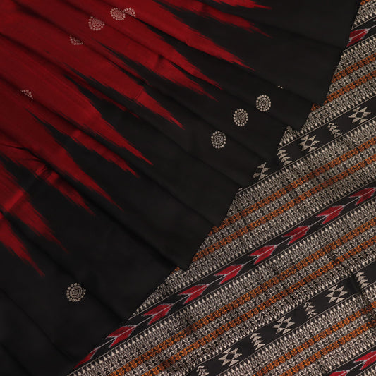 Close-up texture of handwoven Bomkai silk saree fabric: maroon and black threads forming butta pattern.