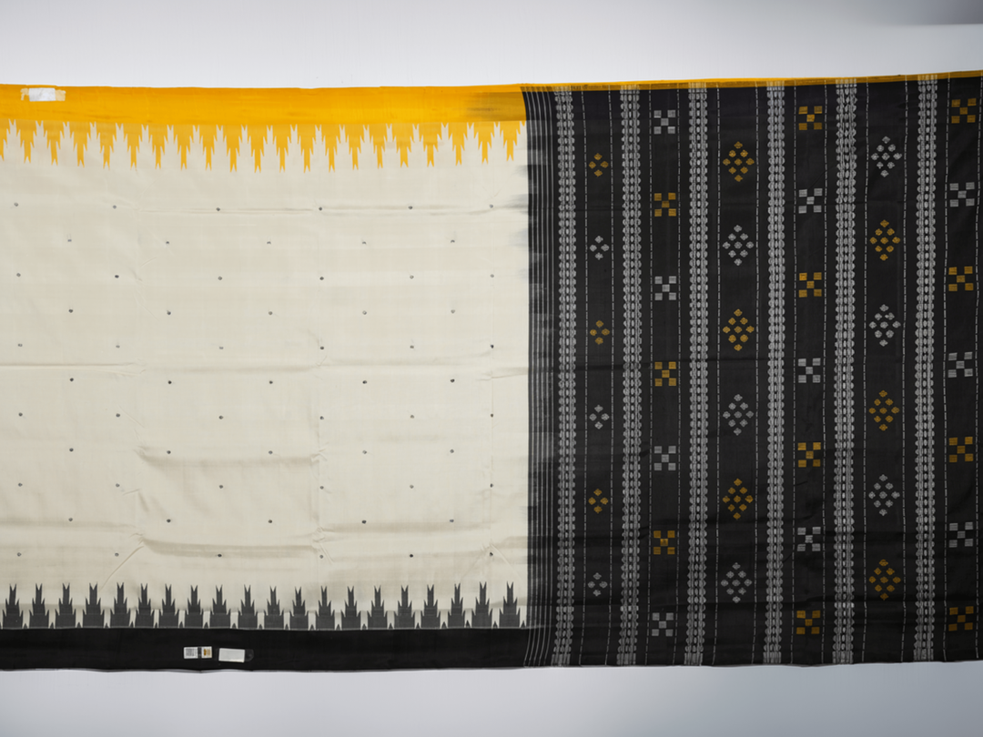 Close-up of the luxurious Berhampuri Silk Saree fabric, revealing the fine weave and soft texture.