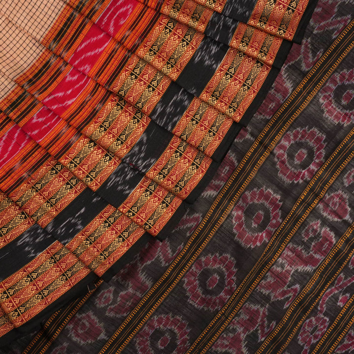 Model elegantly draped in a cream and black Sambalpuri cotton handloom saree with traditional ikat motifs.