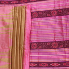 Close-up of green and pink plain Sambalpuri silk saree fabric texture.