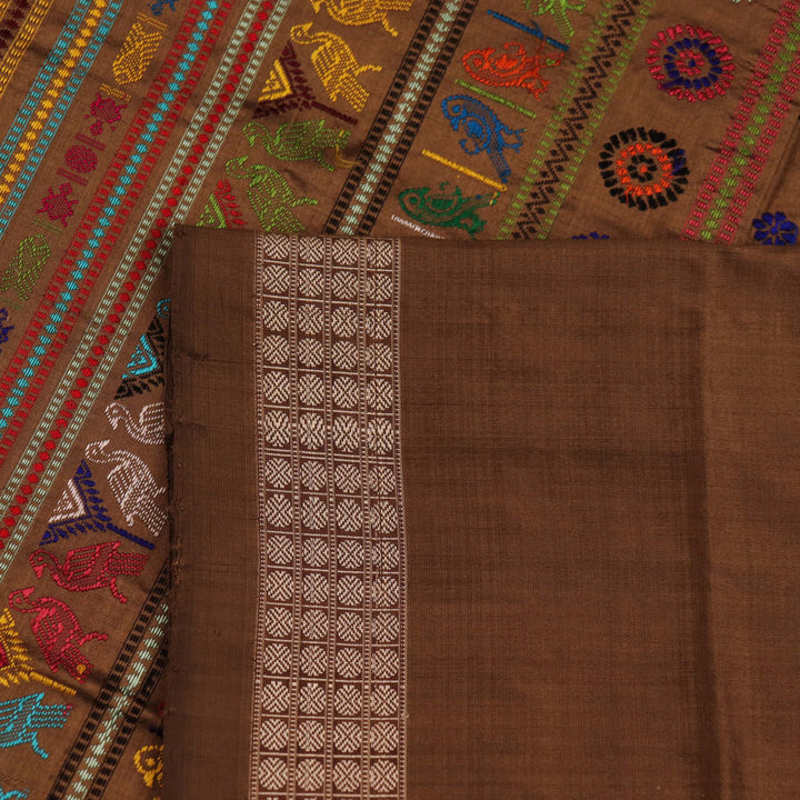 Close-up of Yellow and Brown Silk Saree fabric with Butta pattern