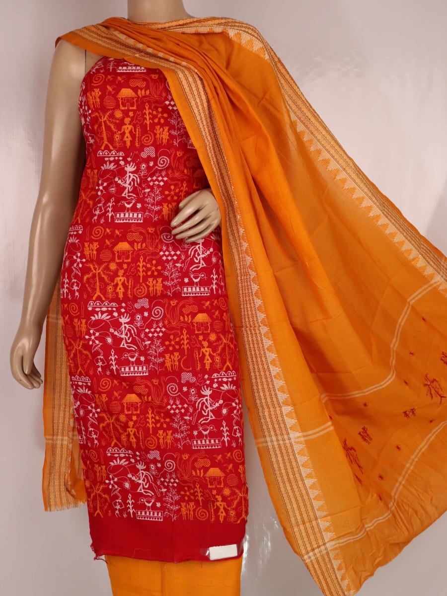 Close-up view of the yellow blouse piece with red doll patterns in Sambalpuri style cotton dress material