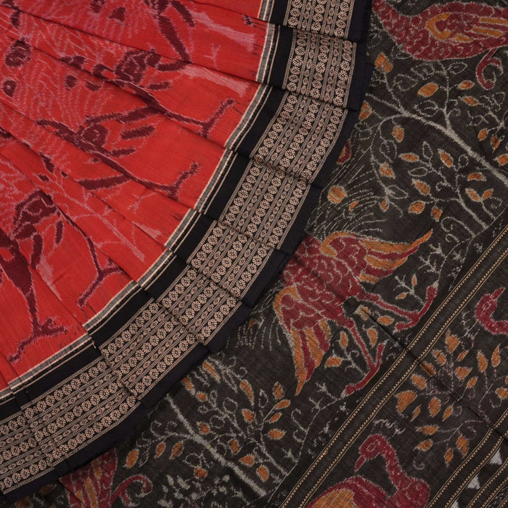 Full layout view of a rust and black Sambalpuri cotton saree displaying the complete body pattern and motifs.