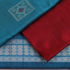 Detail of blue Bomkai silk dress material blouse piece with maroon butta.