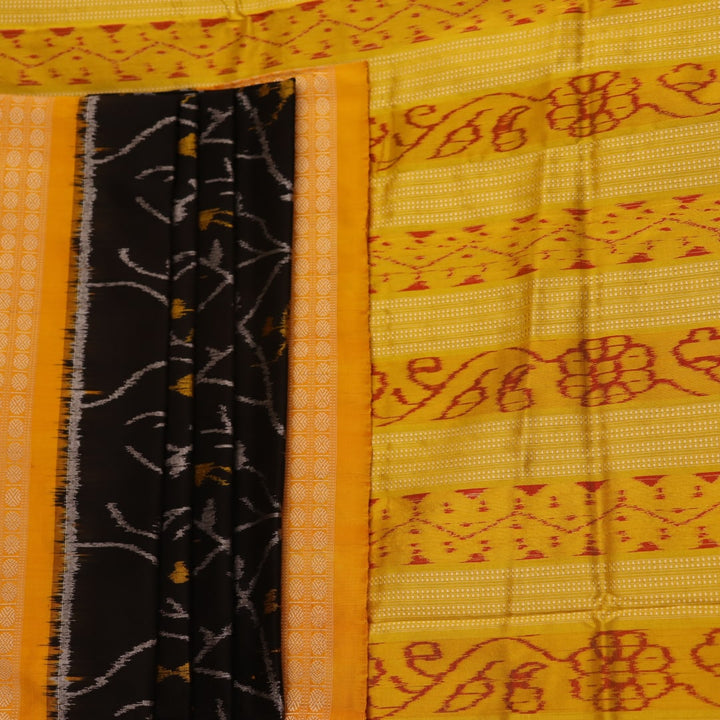 Close-up showcasing intricate silk fabric texture in black and yellow motifs