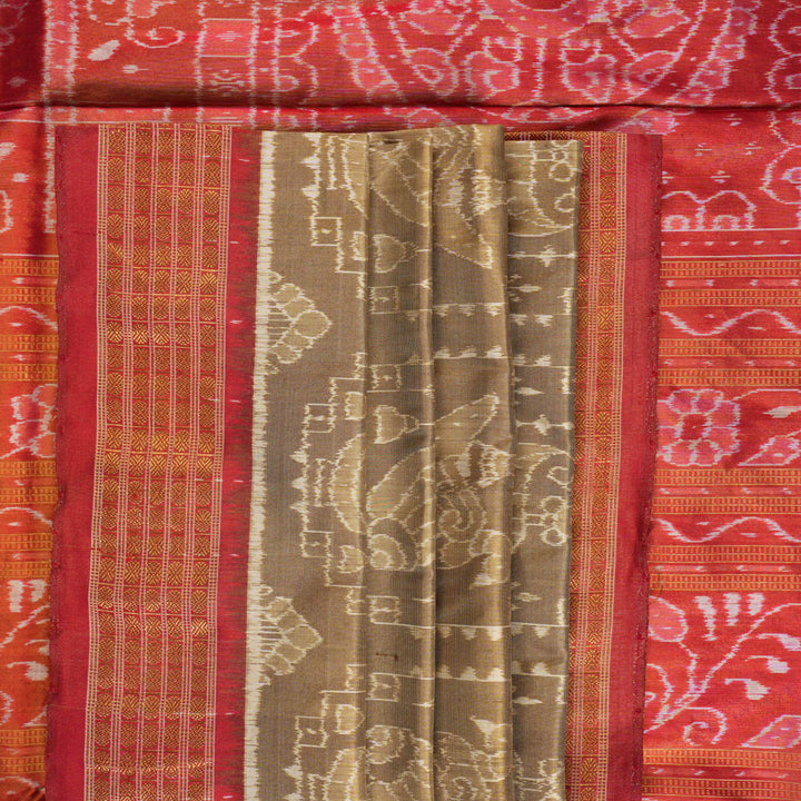 Ultra close-up of Sambalpuri silk saree fabric, showing luxurious texture and tissue motif weave.
