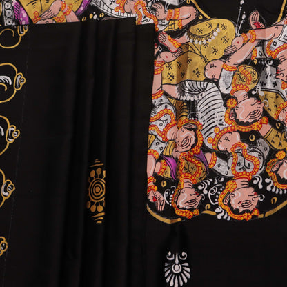 Close-up of black silk Patachitra saree fabric, showcasing hand-painted texture and detail.