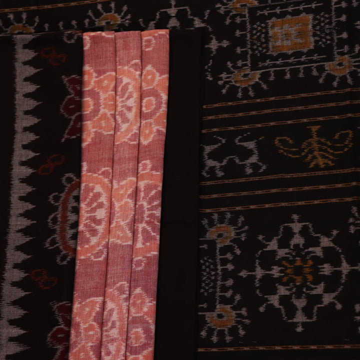 Full view of a peach-colored Sambalpuri cotton saree with black motifs.