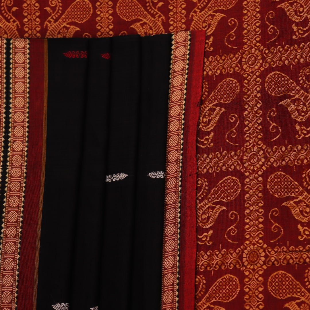 Full view of a black cotton Bomkai saree with rust-colored butta patterns and pallu.