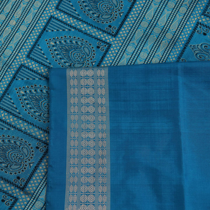 Close-up of Intricate Bomkai Silk Saree Fabric Texture in Black and Blue with Butta Pattern