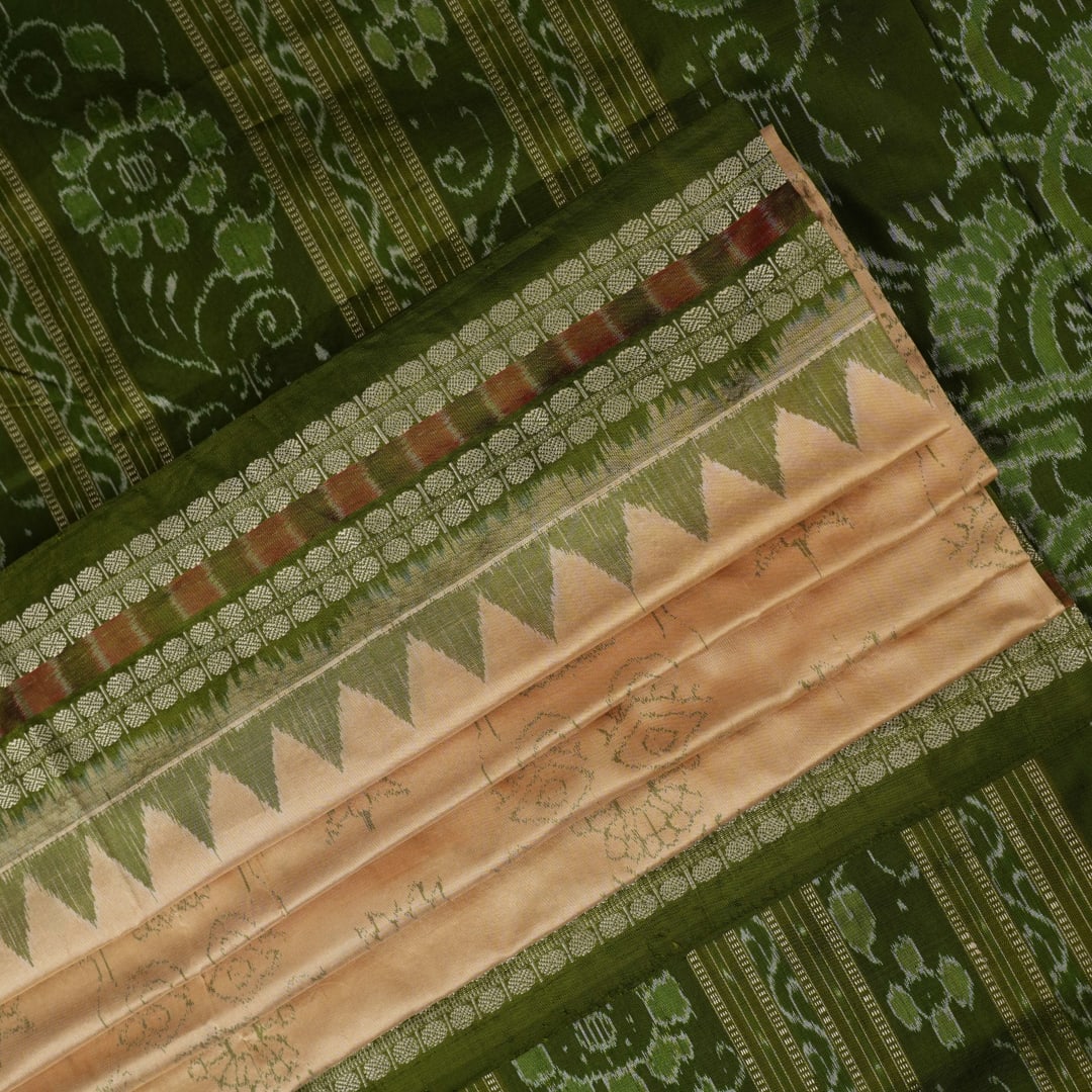 Extreme close-up of cream Sambalpuri silk saree showing exquisite handloom weave texture.
